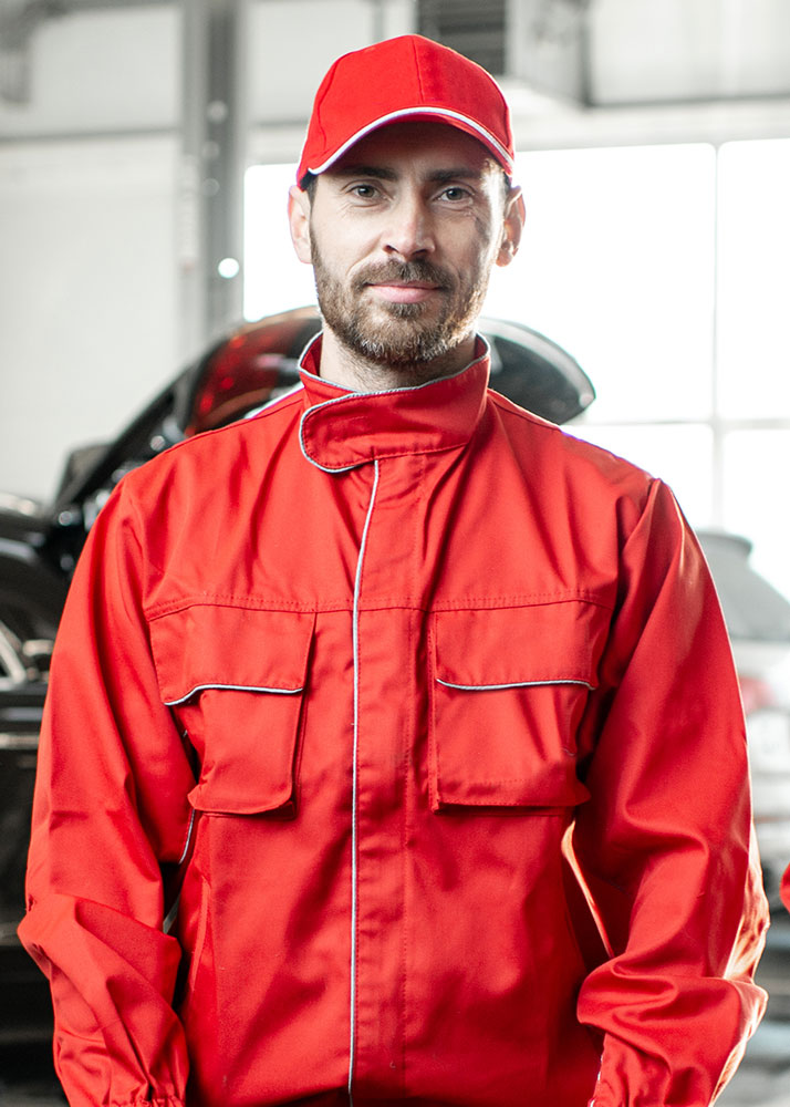 portrait of an auto mechanics indoors 1