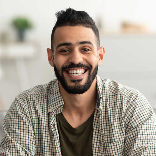 testi portrait of handsome young arab man smiling and l